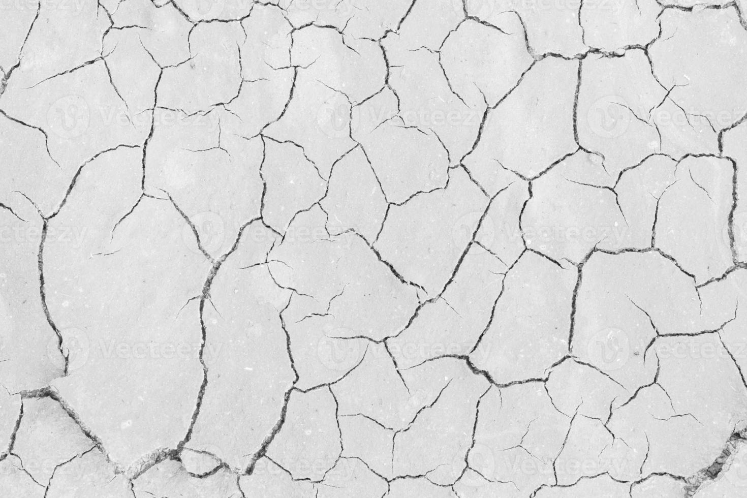 Soil drought cracks texture white background for design. photo