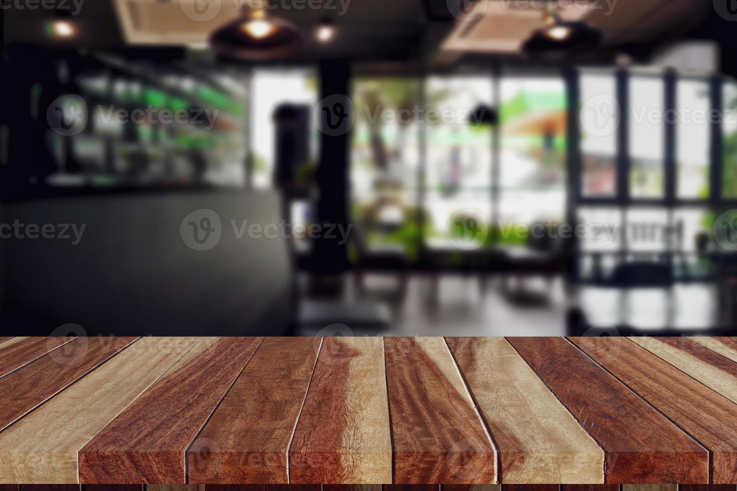 wood table top in coffee shop blank for design photo