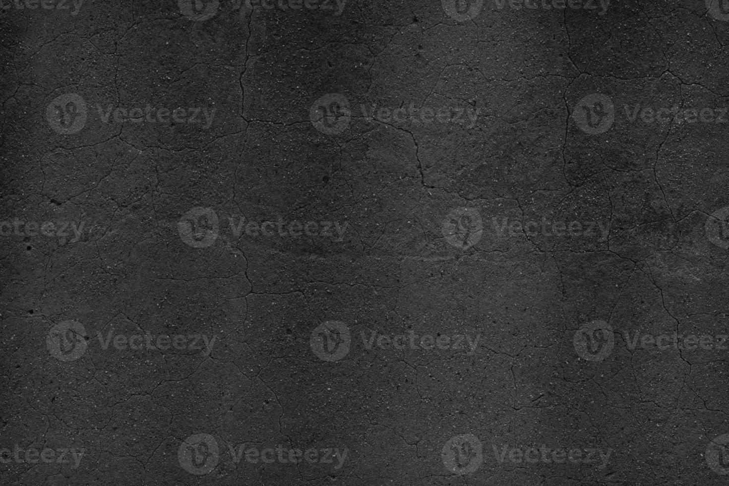 Black Cement scratch background. Texture placed over an object to create a grunge effect for your design. photo