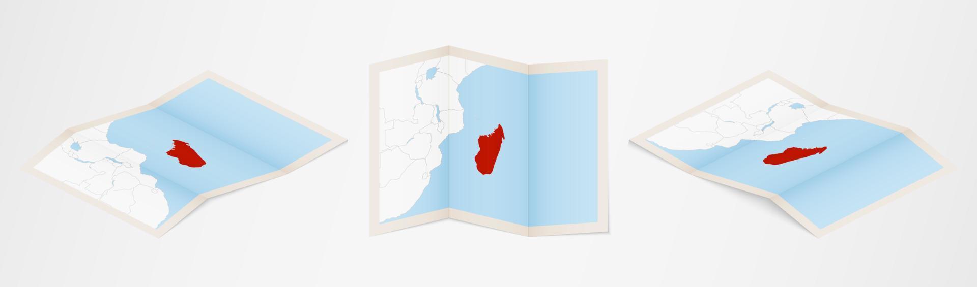 Folded map of Madagascar in three different versions. vector