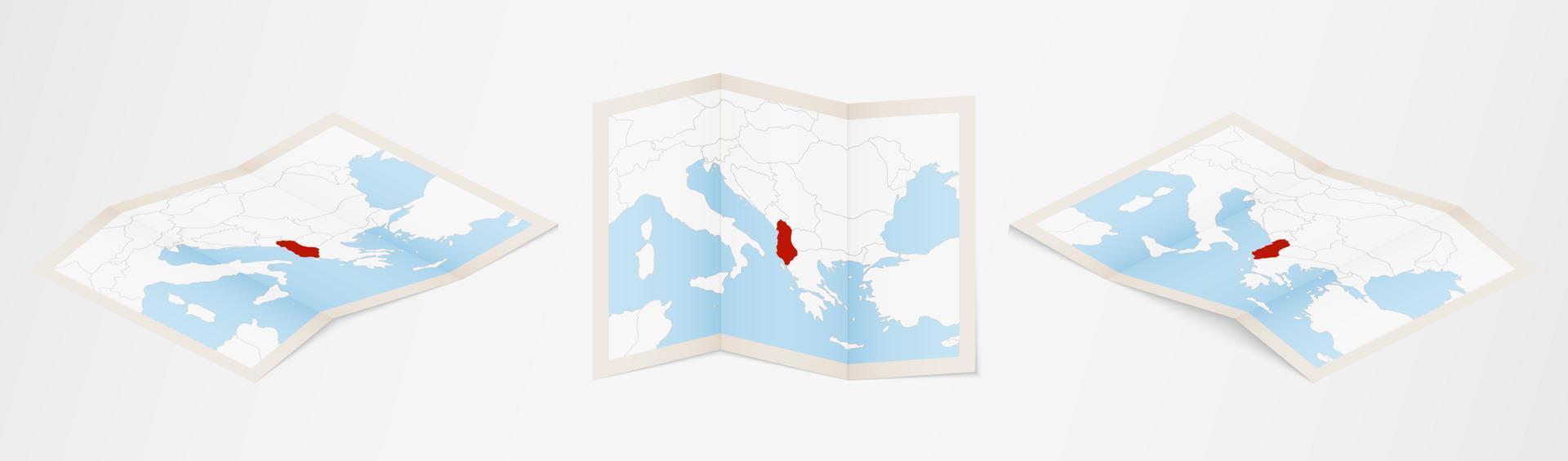 Folded map of Albania in three different versions. vector