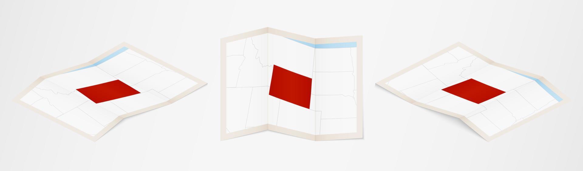 Folded map of Wyoming in three different versions. vector