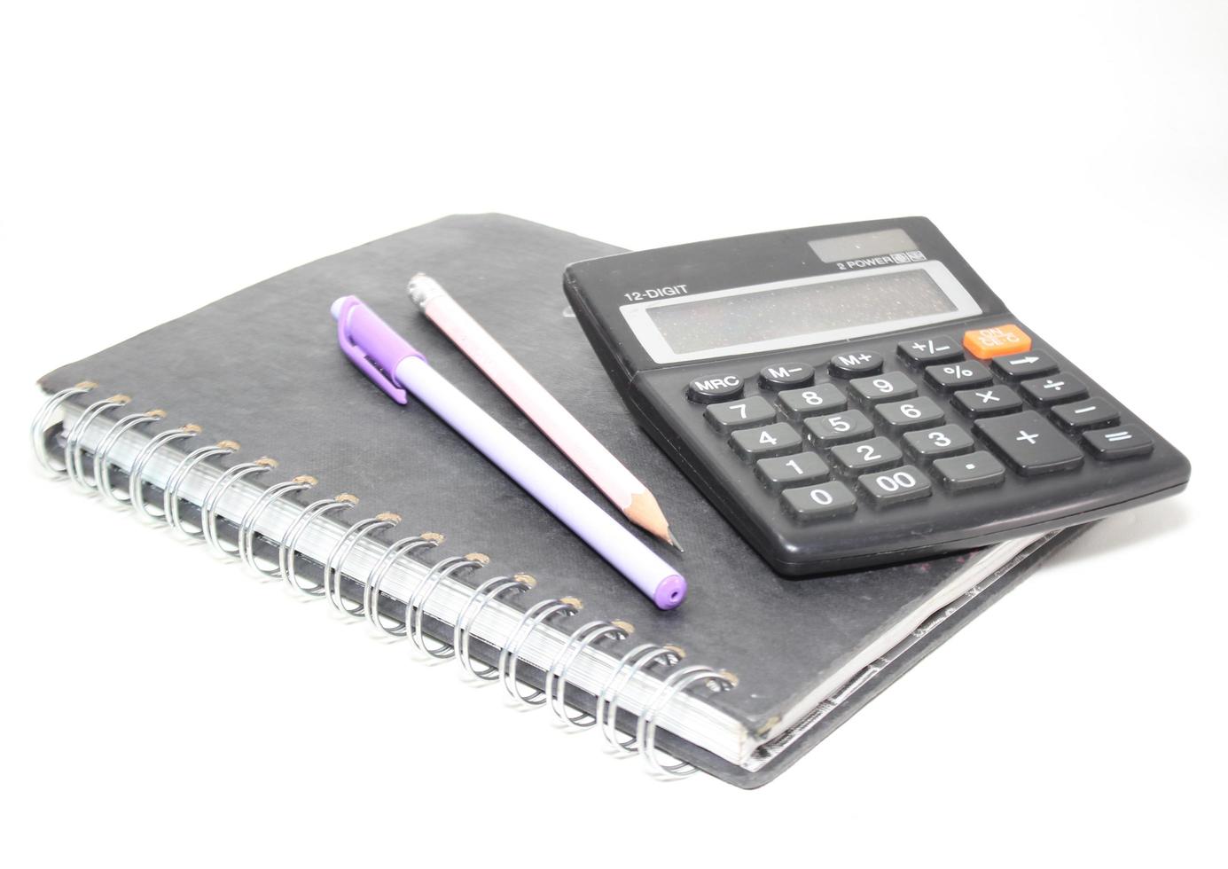 Black digital calculator isolated on the top view white background photo