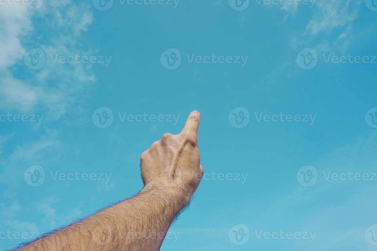 hand up in the air, gesturing in the sky feeling free photo