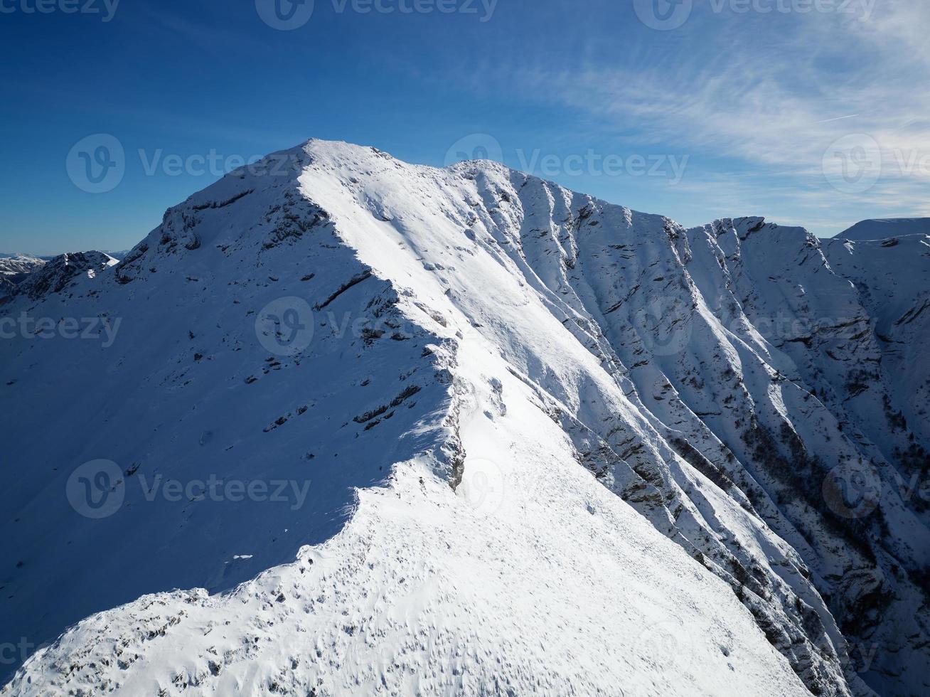 Amazing view of different mountain peaks with snow during winter. Beautiful mountain range and amazing attraction for alpine climbers. Adventurous lifestyle. Challenging mountain ridge for climbers. photo