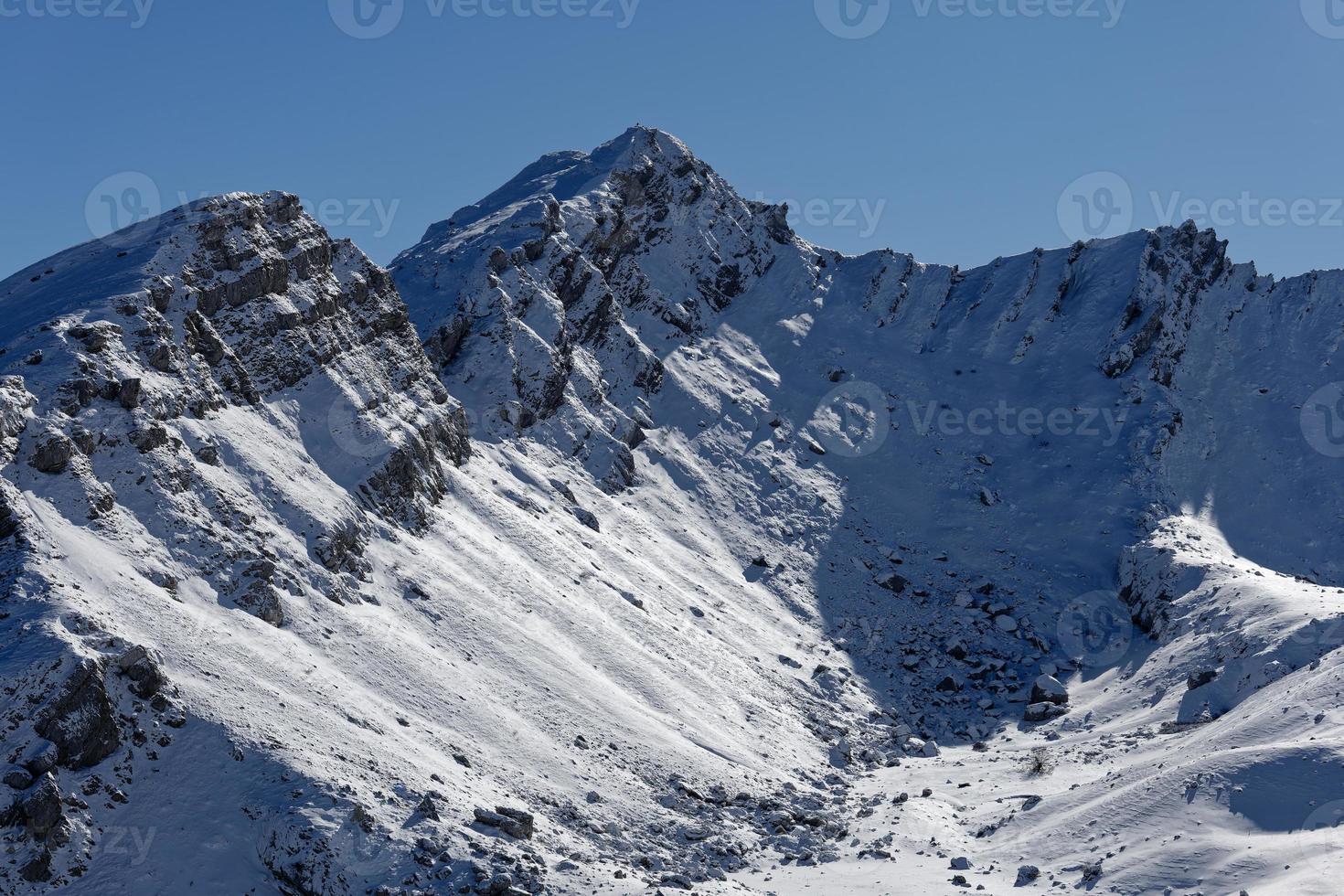 Amazing view of different mountain peaks with snow during winter. Beautiful mountain range and amazing attraction for alpine climbers. Adventurous lifestyle. photo