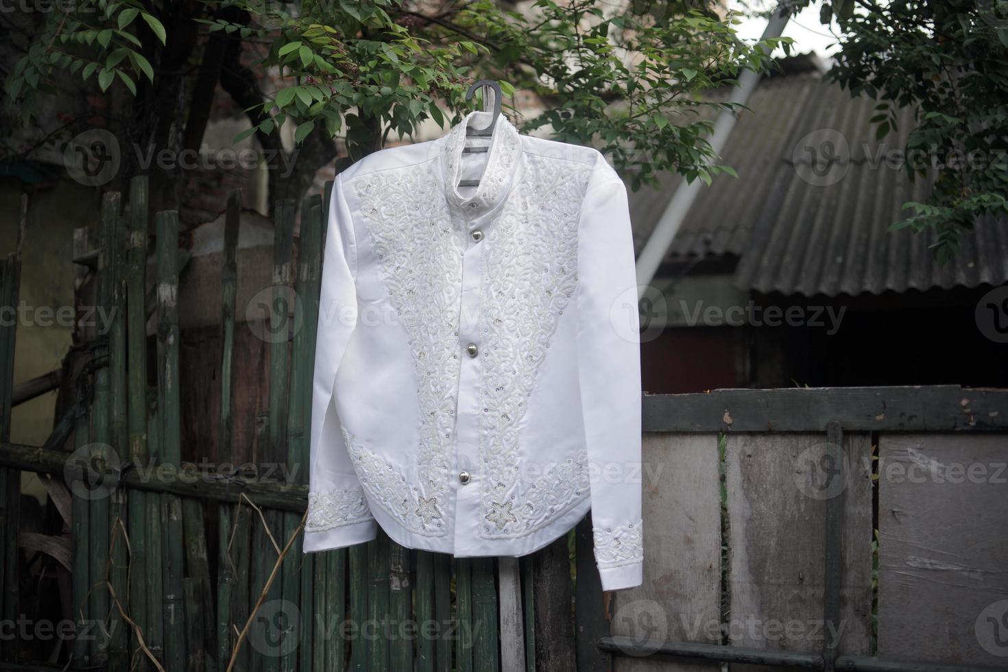 Beautiful Groom's Wedding Dress for a Traditional Wedding Ceremony in Indonesia photo