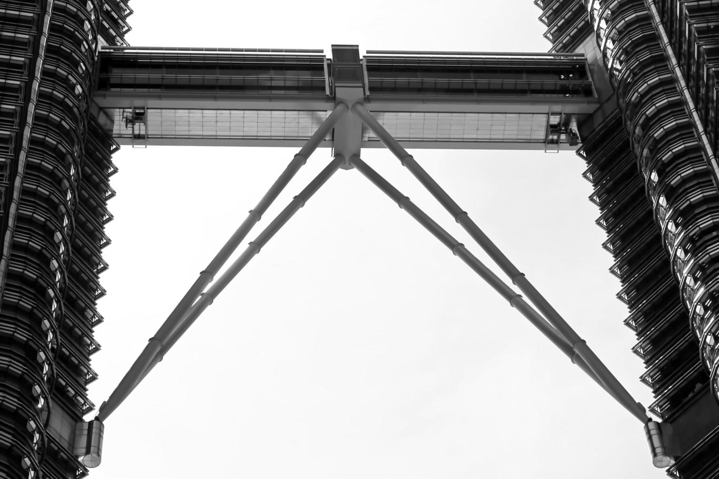 KUALA LUMPUR-FEB-02-28-2016, wonderful place skyline skyscraper walkway, with white sky above top twin black towers urban vacation. February in Kuala Lumpur, Malaysia. photo