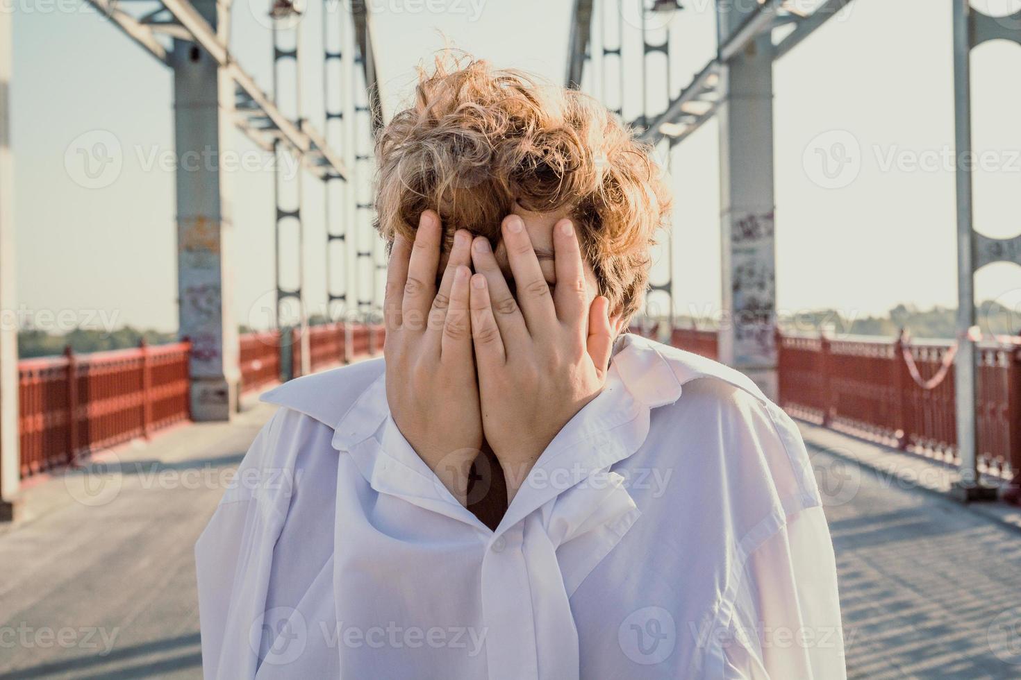 Close up short haired woman covering face with hands portrait picture photo