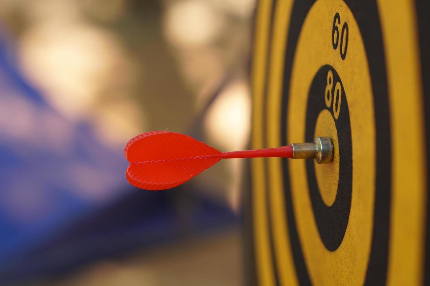 Darts on black and yellow targets photo