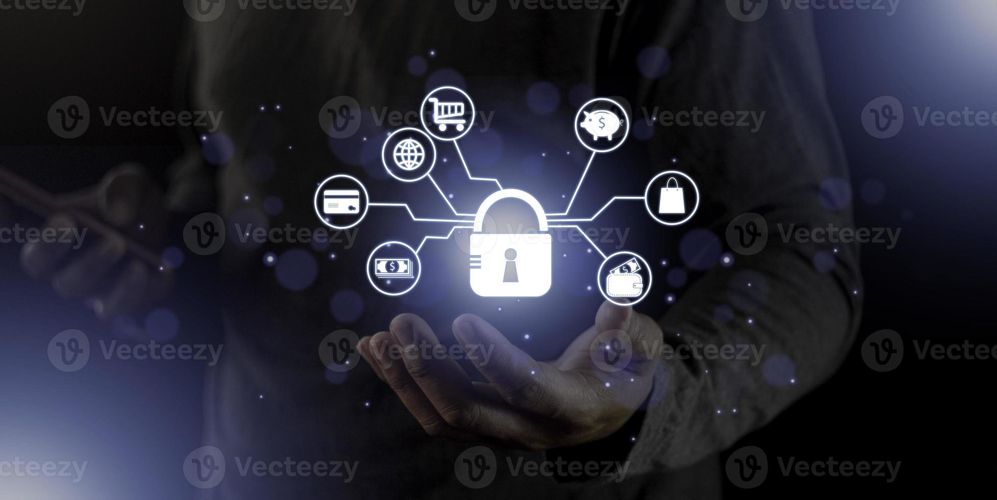 cyber security internet and networking concept. Businessman hand working with VR screen padlock icon on computer background photo