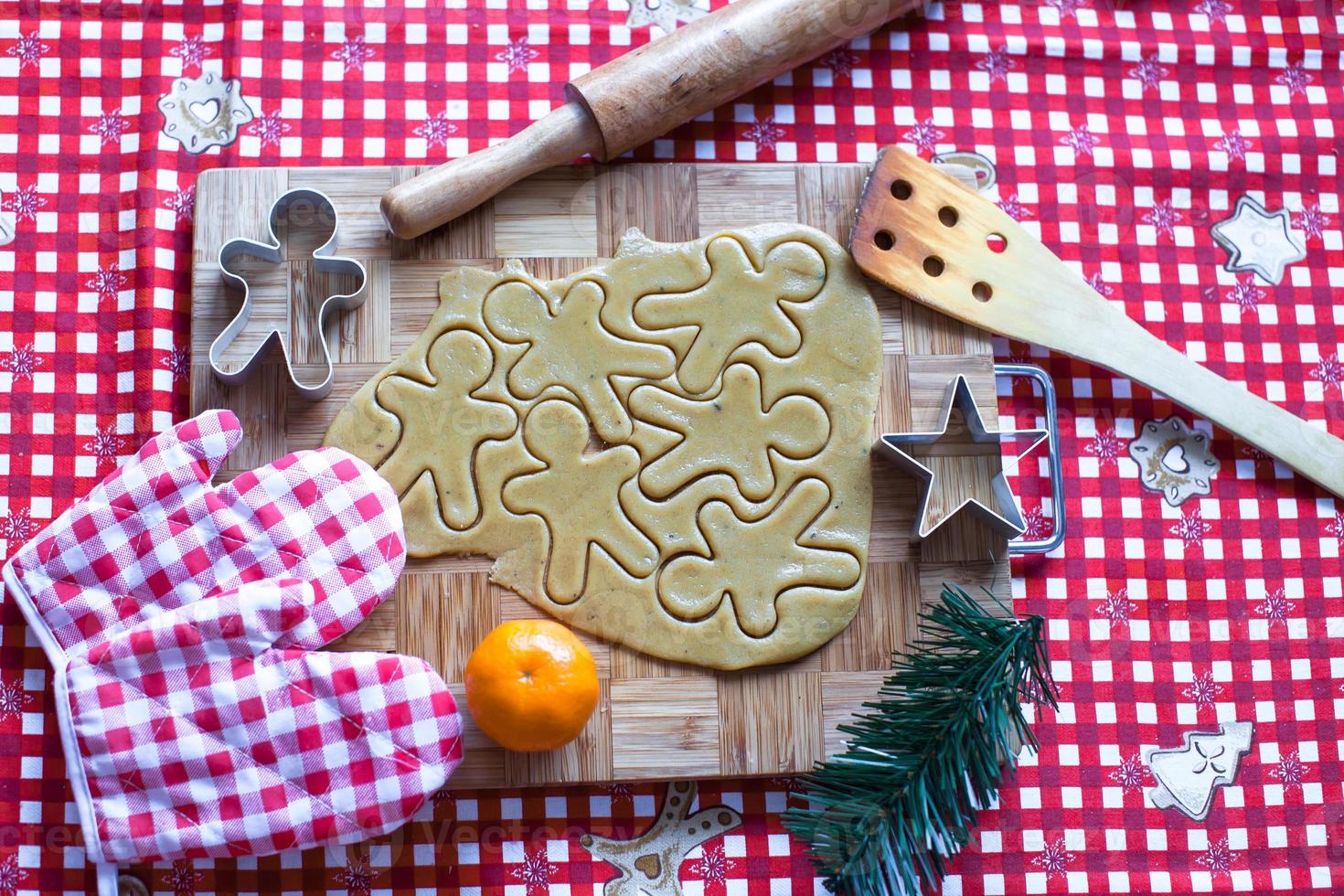 Making gingerbread man and christmas cookies photo