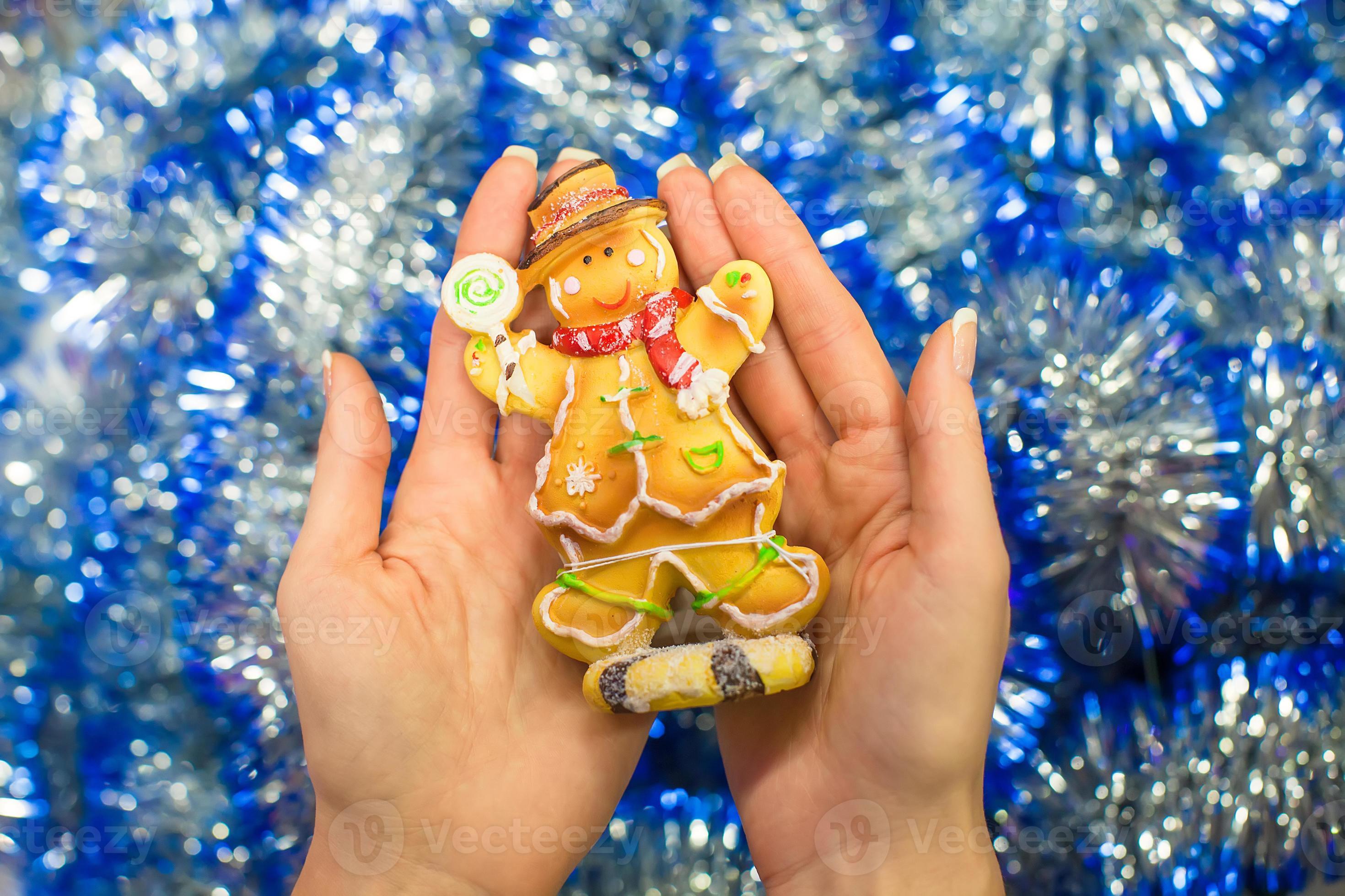 Colorful gingerbread man in female hands 17698407 Stock Photo at Vecteezy
