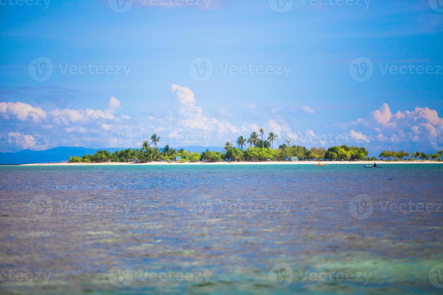 Uninhabited tropical island in the open ocean in the Philippines photo