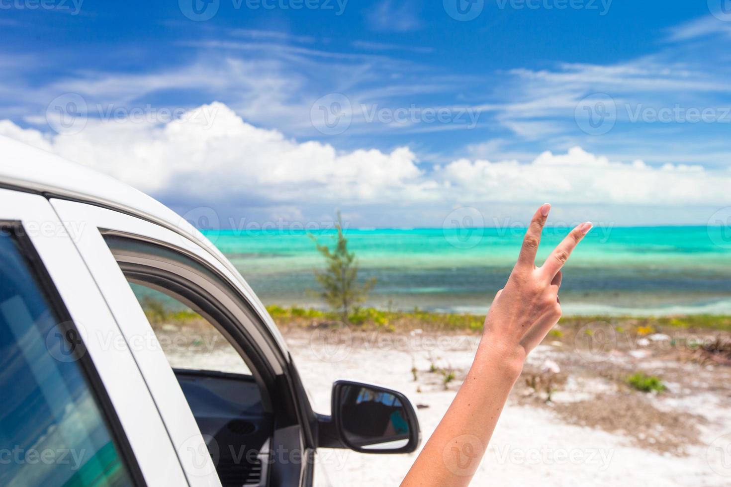 Close up raised hands at perfect beach photo