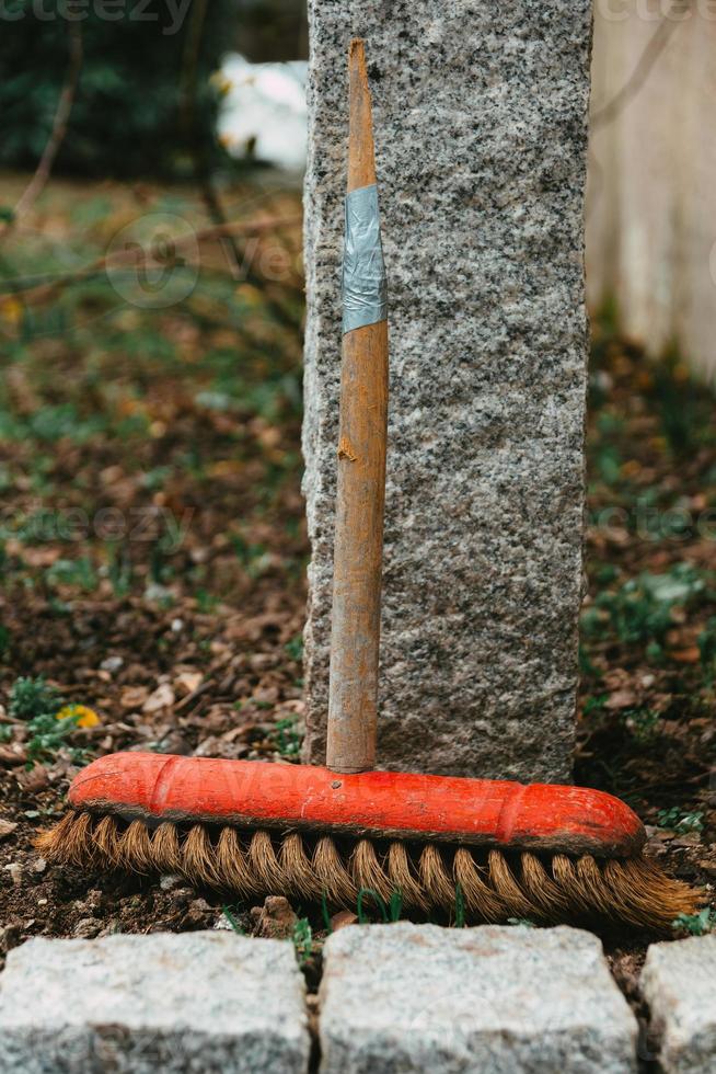 small broom on the side of the road photo