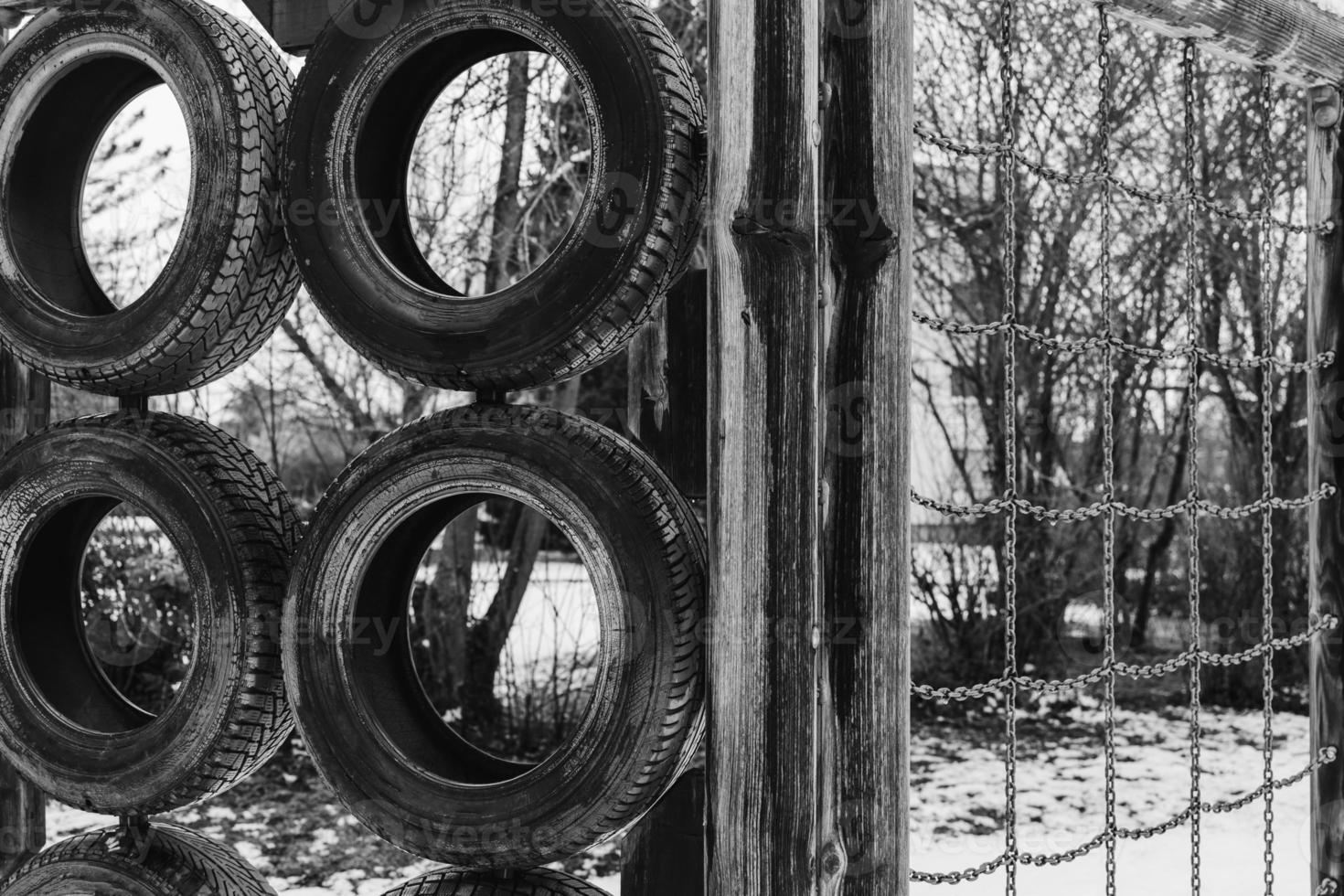 a climbing frame with old car tires photo