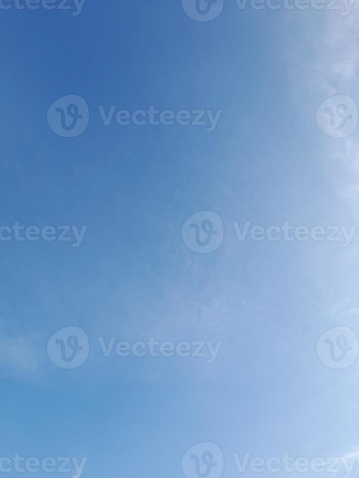 Beautiful white clouds on deep blue sky background. Large bright soft fluffy clouds are cover the entire blue sky. photo