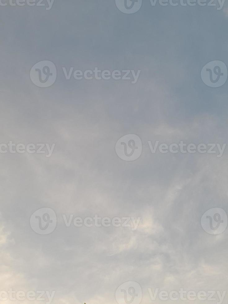 Beautiful white clouds on deep blue sky background. Large bright soft fluffy clouds are cover the entire blue sky. photo