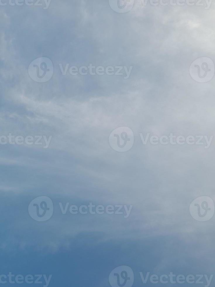 Beautiful white clouds on deep blue sky background. Large bright soft fluffy clouds are cover the entire blue sky. photo