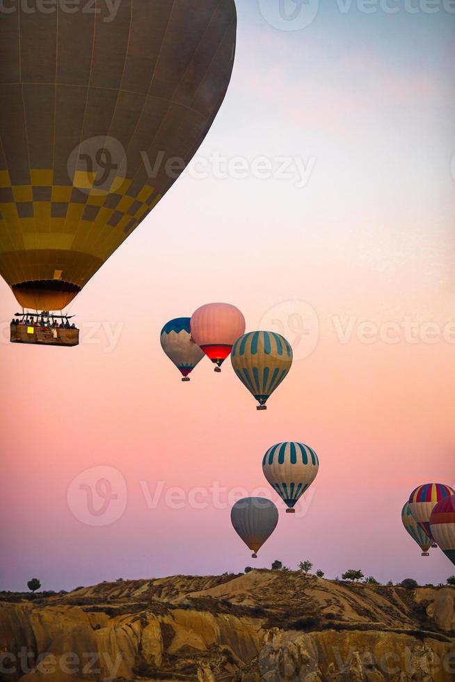 Bright hot air balloons in sky of Cappadocia, Turkey photo