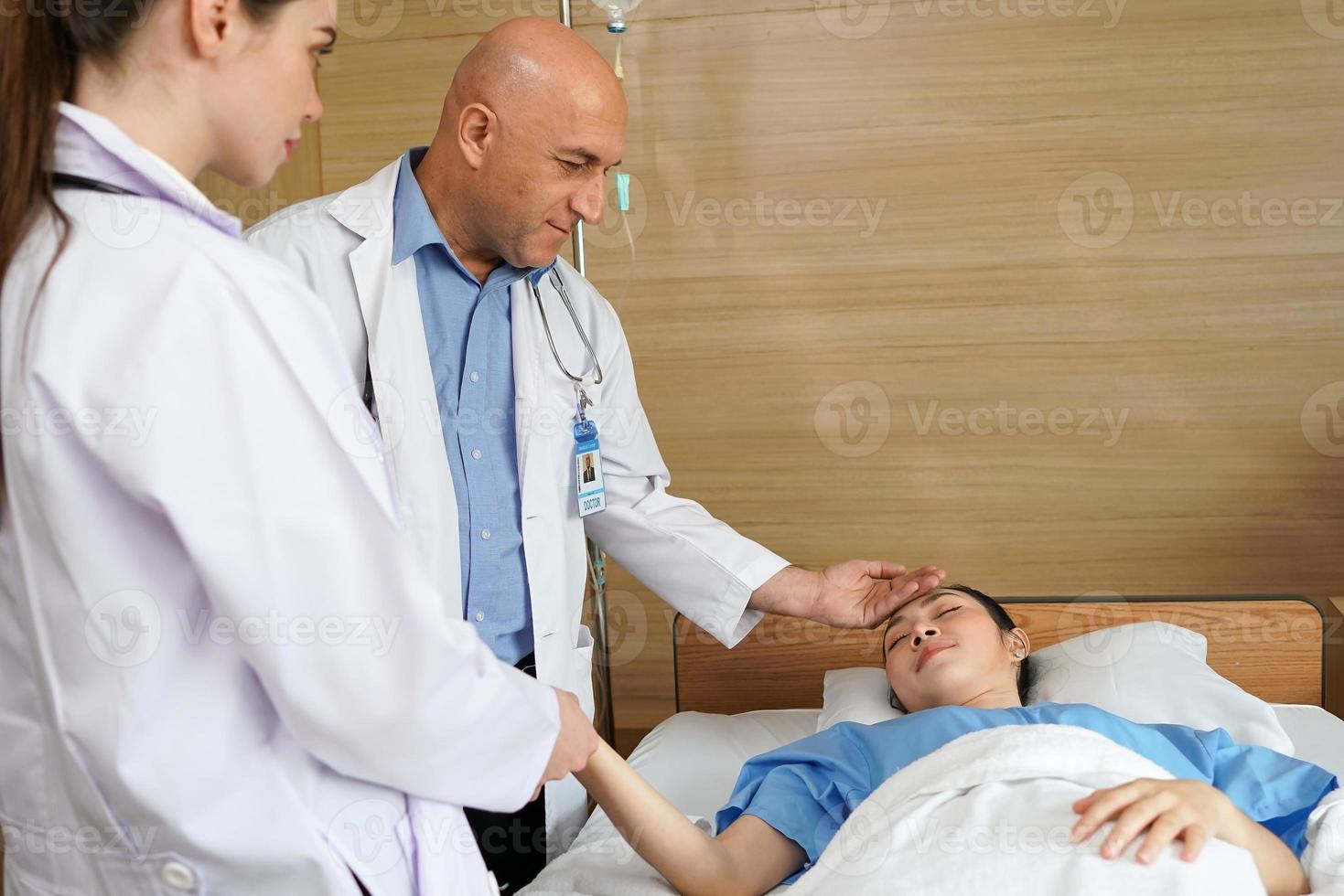 Doctors and woman patient discussion about medicine in hospital. Medical expertise person standing together in hospital ward room confidence talking. Professional healthcare nurse working with doctor photo