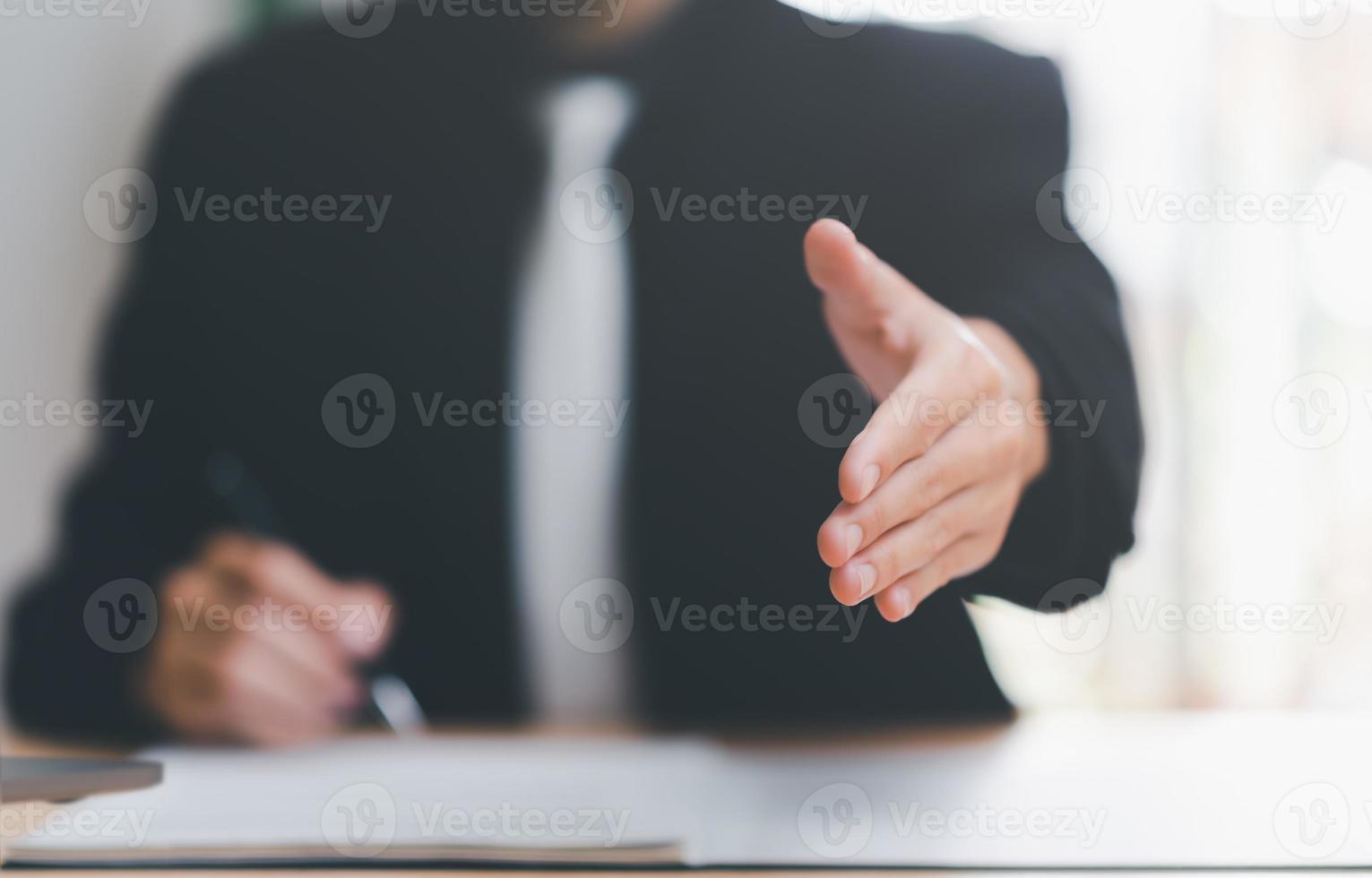 Businessman showing hand shake,showing successful business deals,concept progress development, financial efficiency and investment with business strategy for goals and opportunities in industry future photo