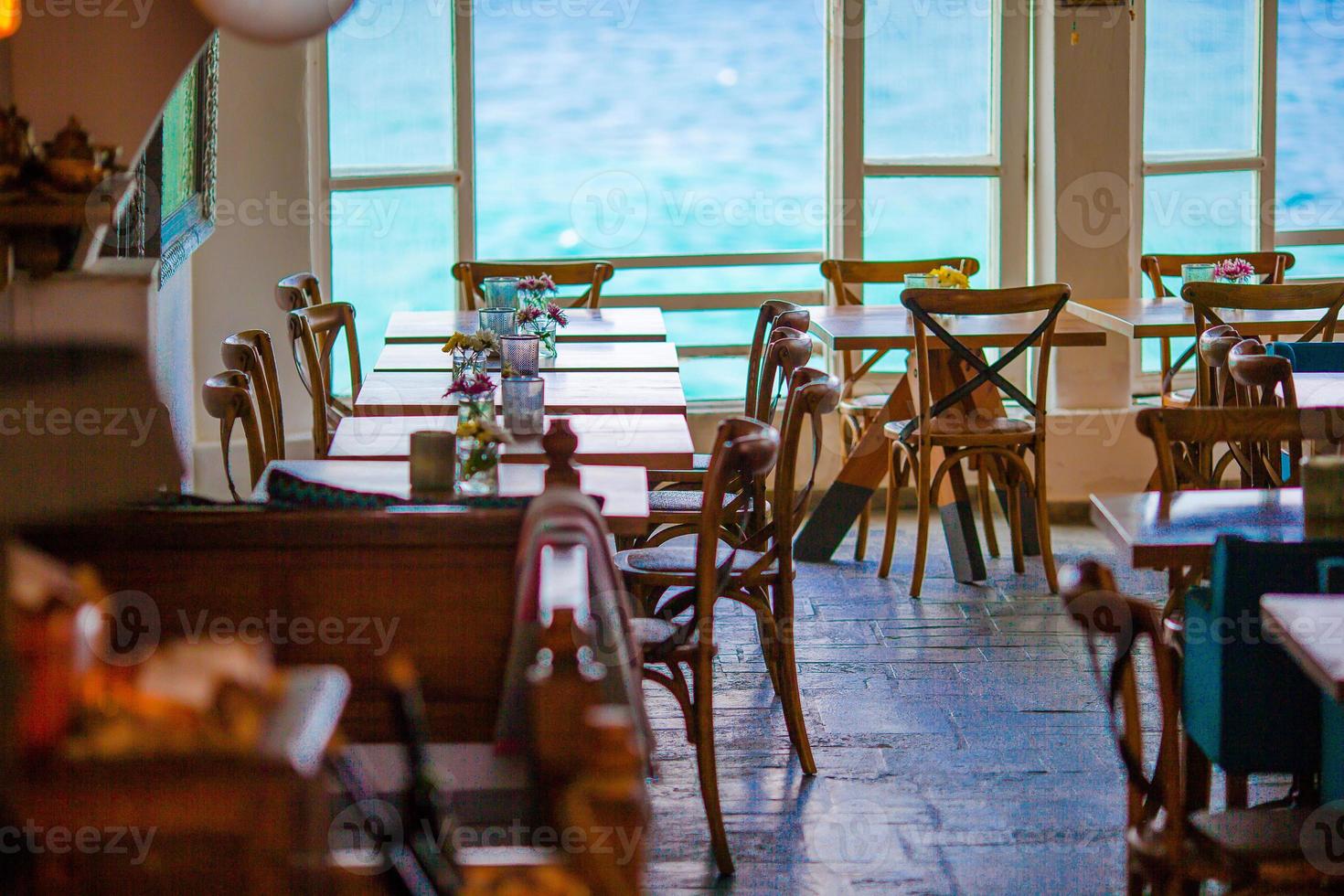 Summer empty openair cafe with beautiful view to the sea in popular area in Mykonos Little Venice photo