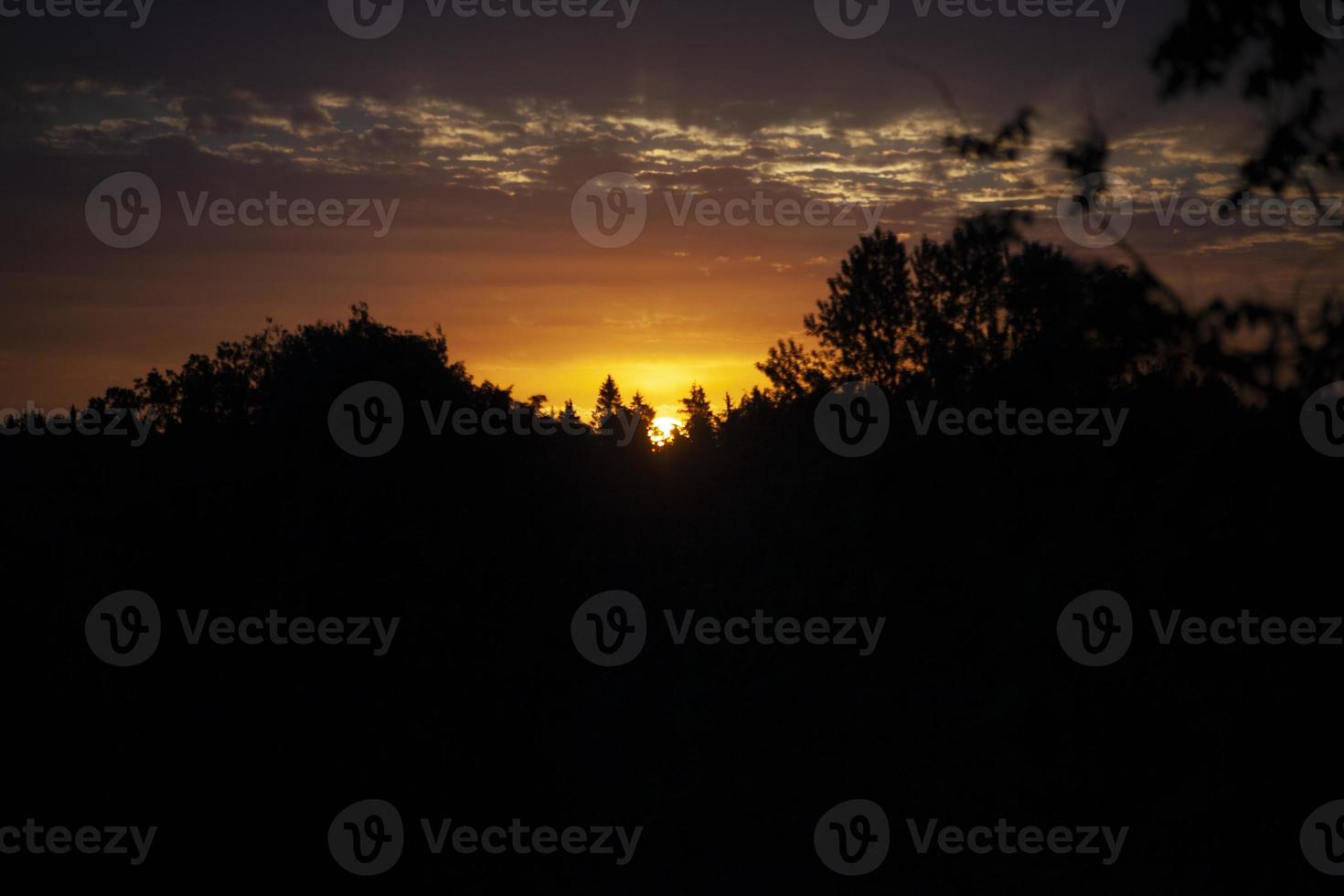 Sunset. Dawn in morning. Warm light in sky. Heavenly landscape in village. photo