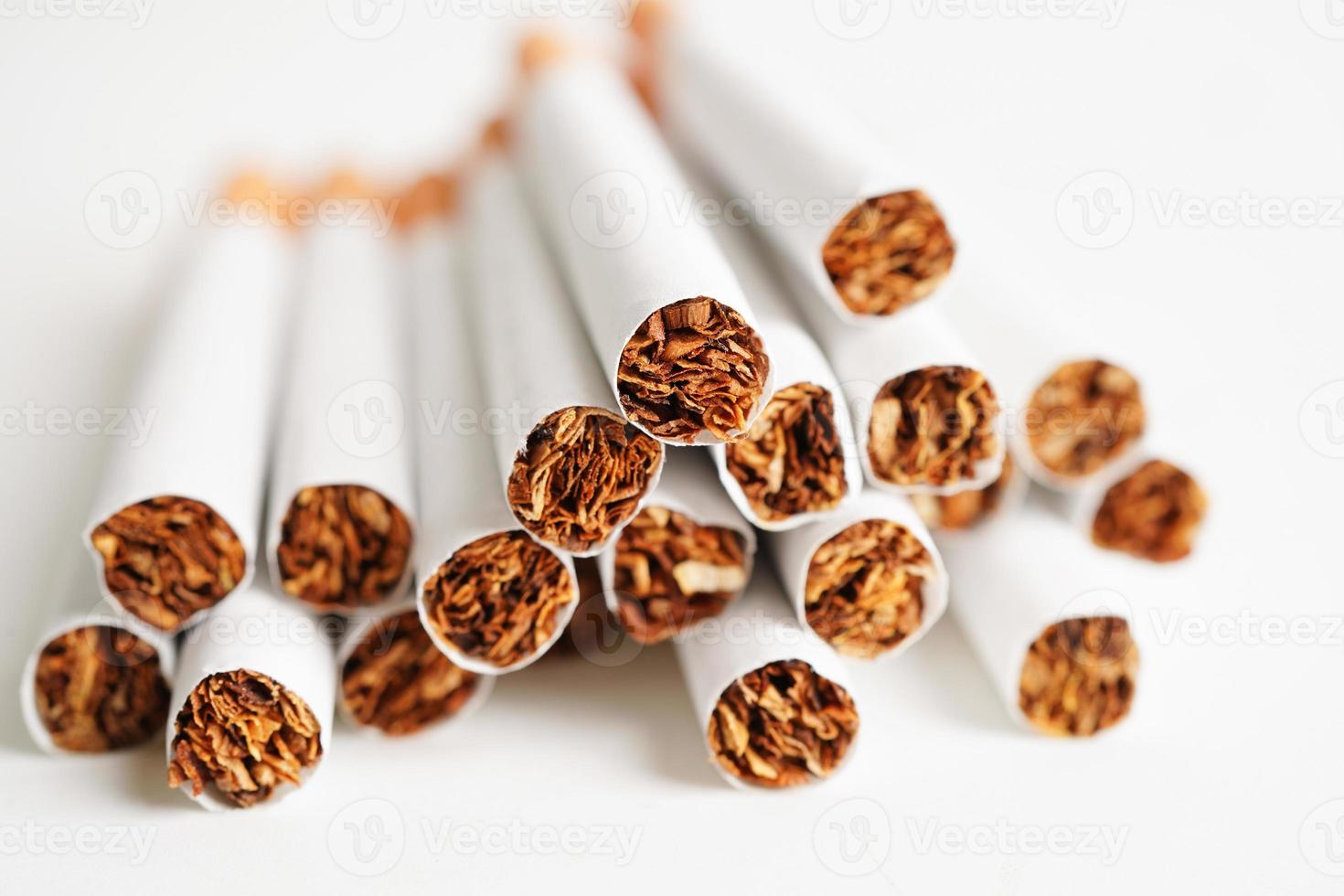 Cigarette isolated on white background with clipping path, roll tobacco in paper with filter tube, No smoking concept. photo