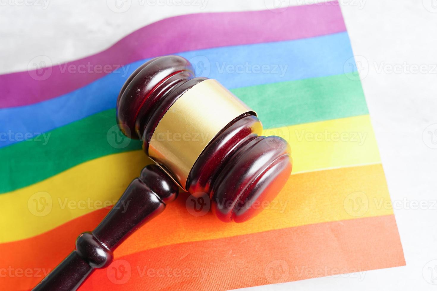 Gavel for judge lawyer with heart rainbow flag, symbol of LGBT pride month. photo