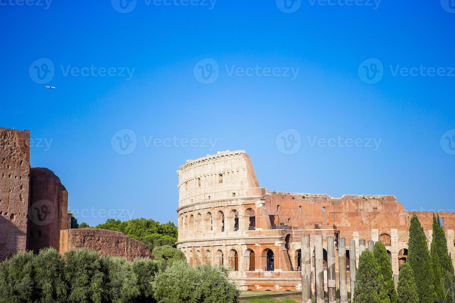Colosseum or Coliseum background blue sky in Rome photo