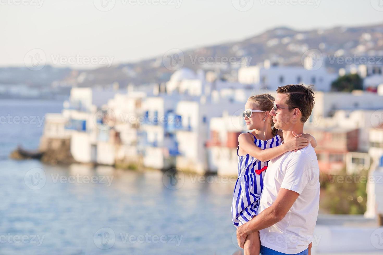 Father and little girl background Little Venice in Mykonos photo