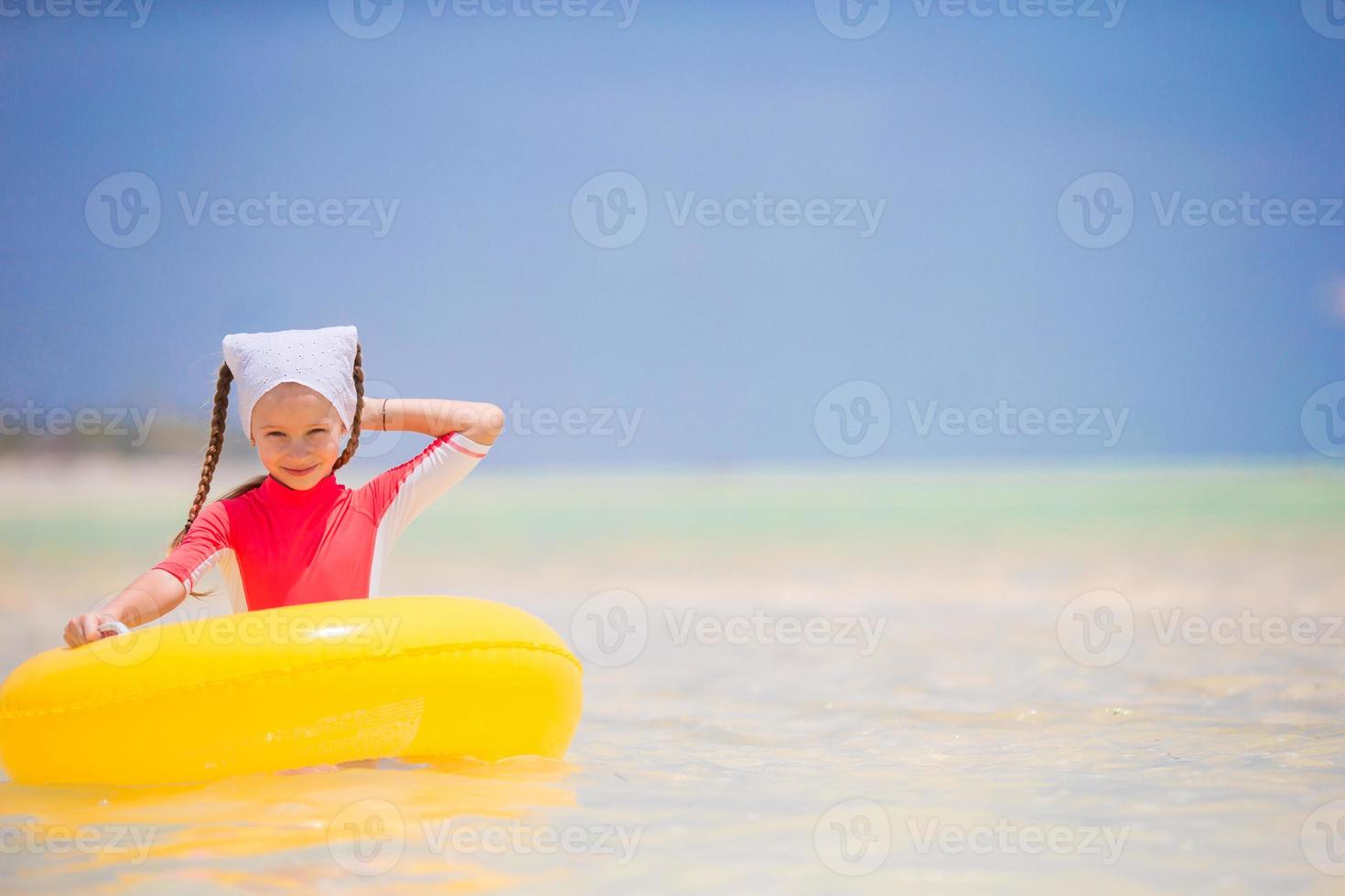 Adorable little girl enjoy beach summer vacation photo