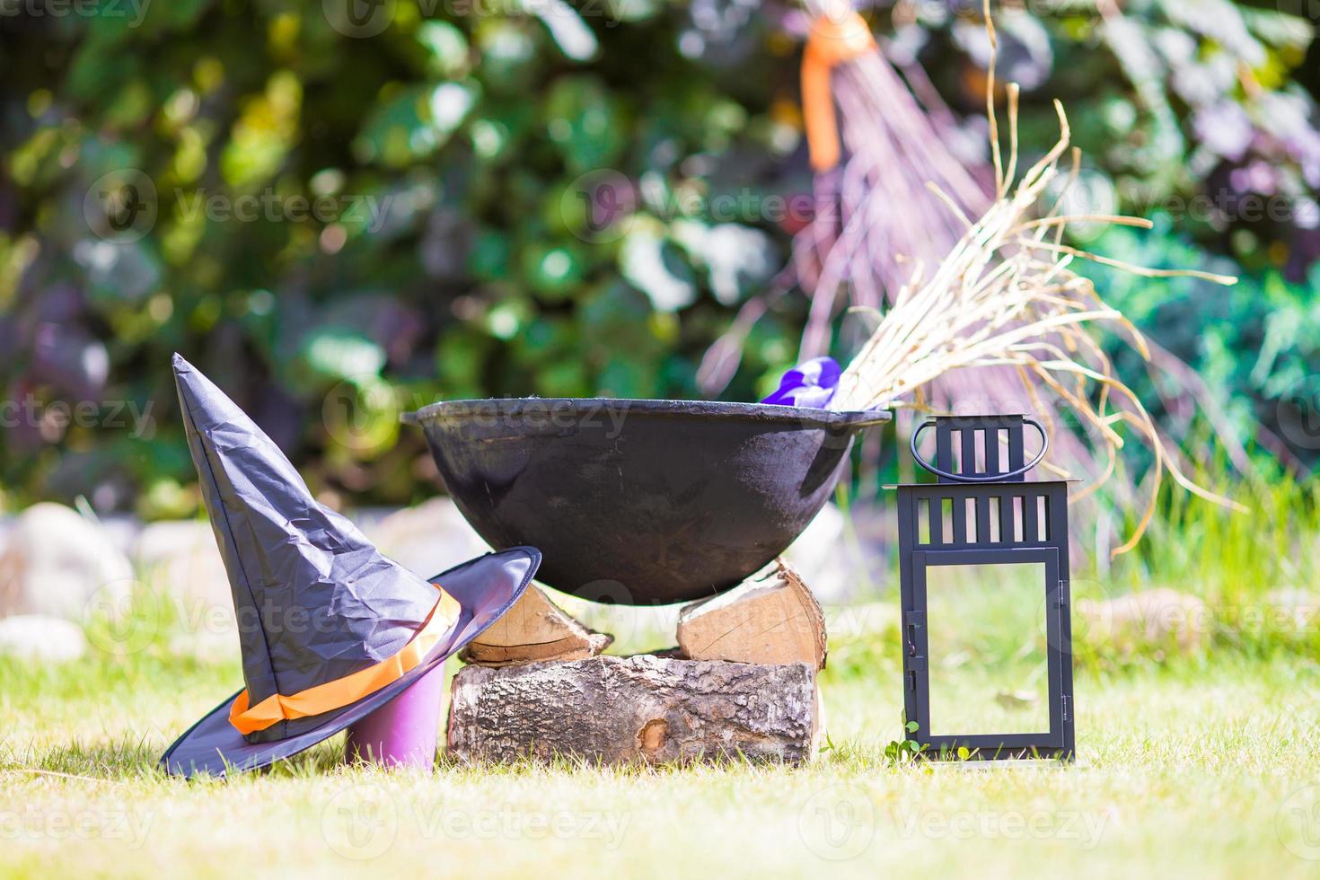 View of Halloween Pumpkins, witch's hat and rake outdoor photo