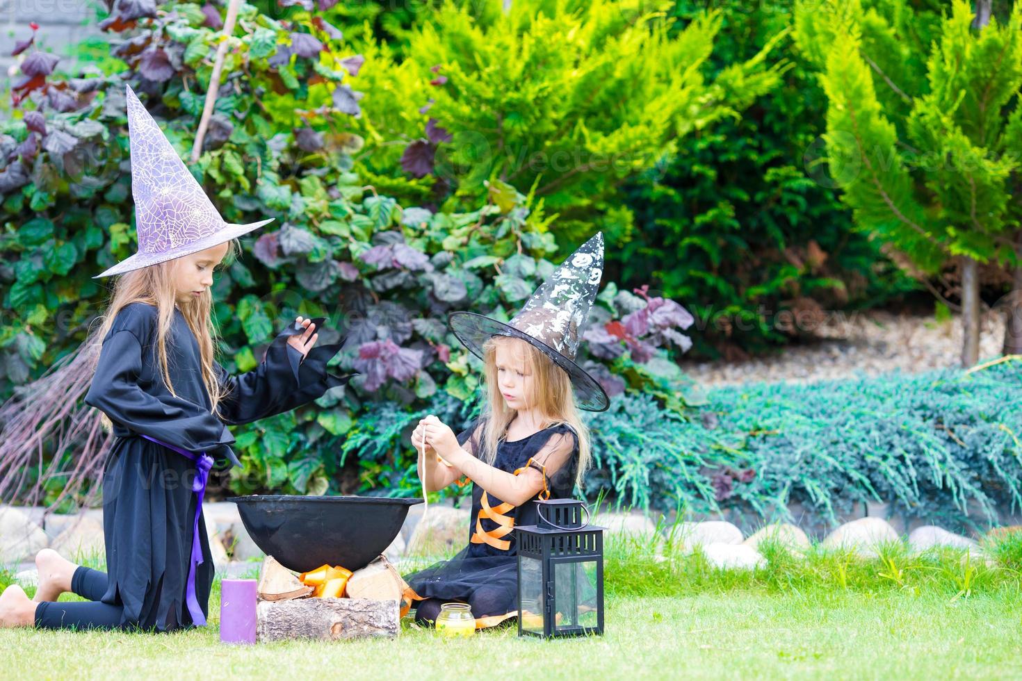 Happy girls in halloween costume with jack pumpkin.Trick or treat photo