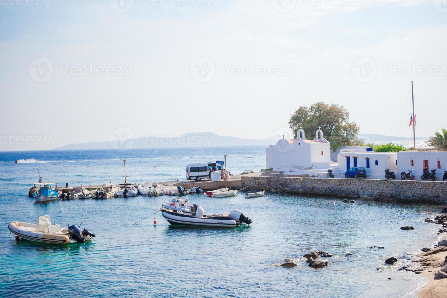 Panoramic view of the Mykonos town harbor from the above hills in Mykonos, Cyclades, Greece photo