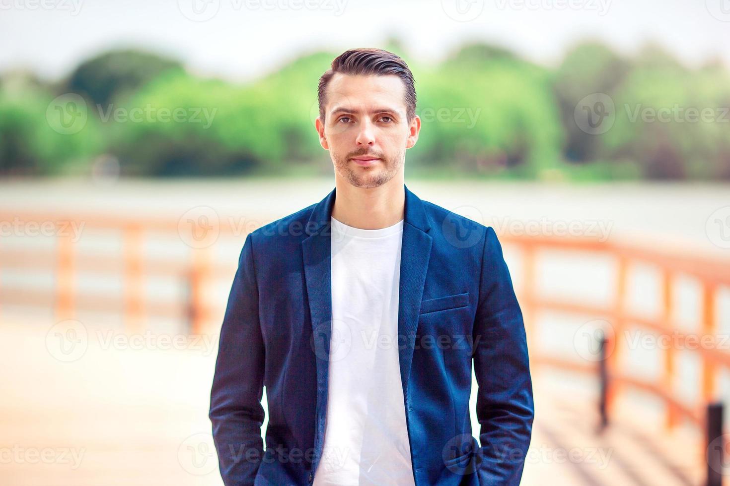 Young man background the old european city photo