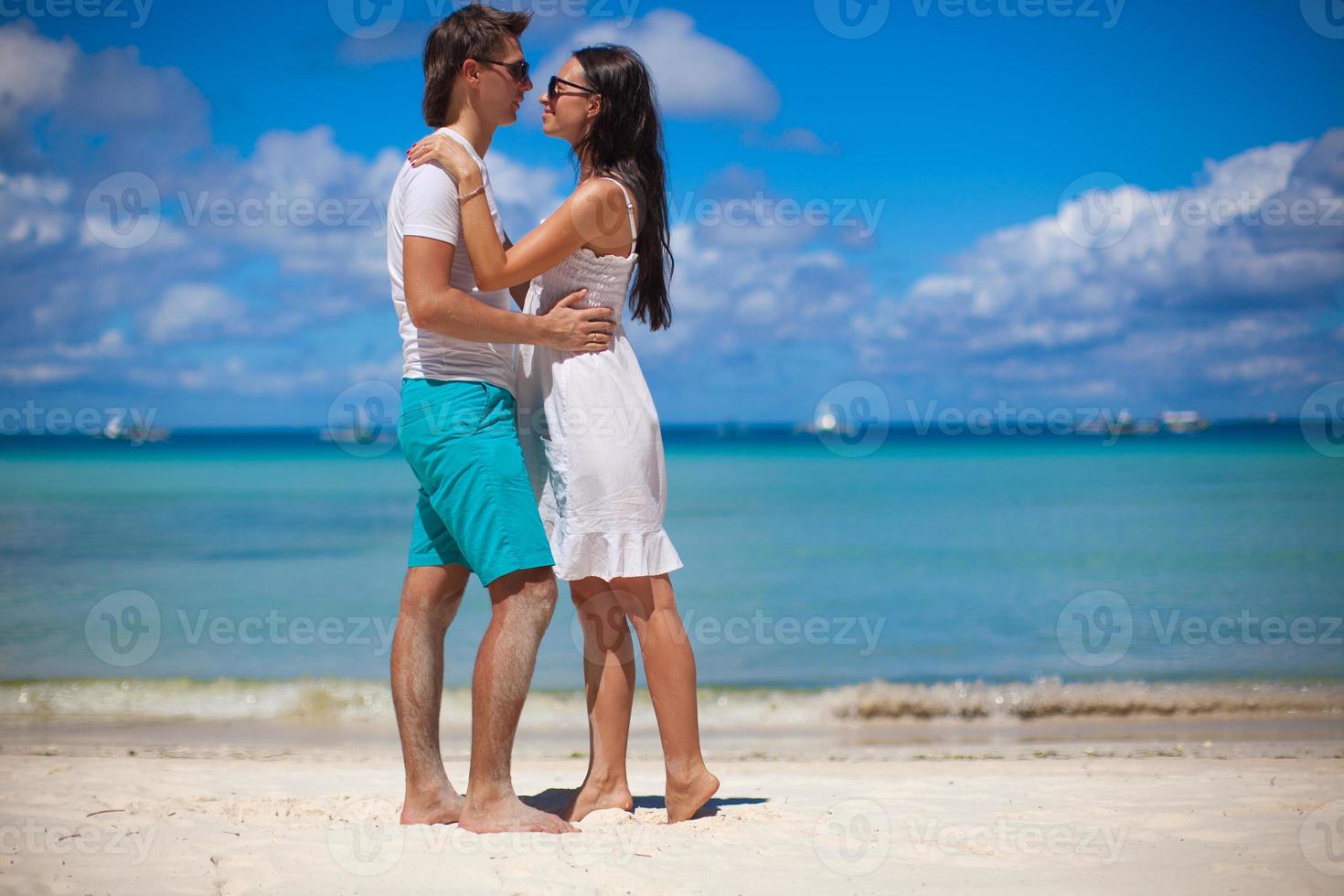 Young couple enjoying each other on a tropical beach photo