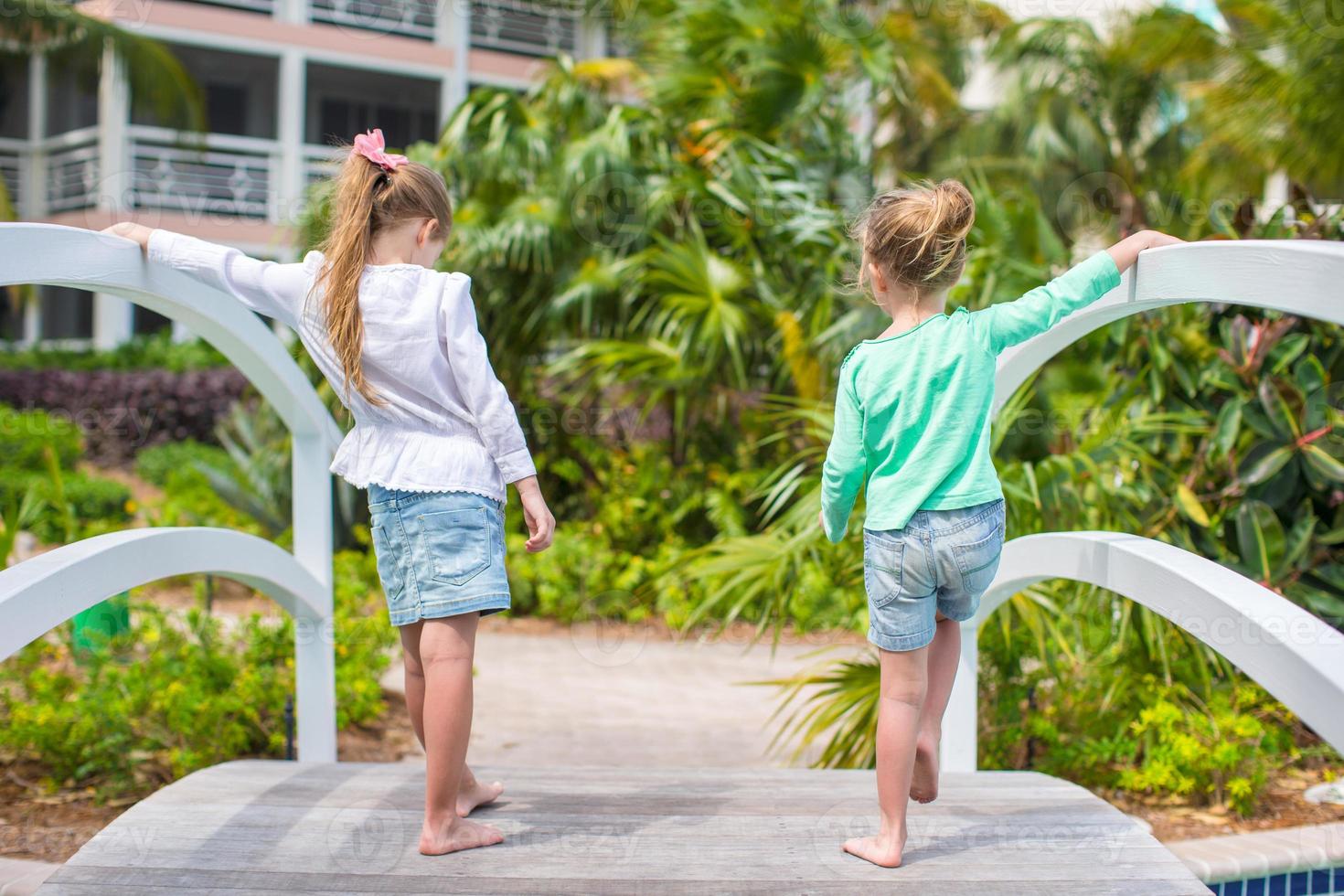 Little adorable girls in a beautiful exotic hotel photo