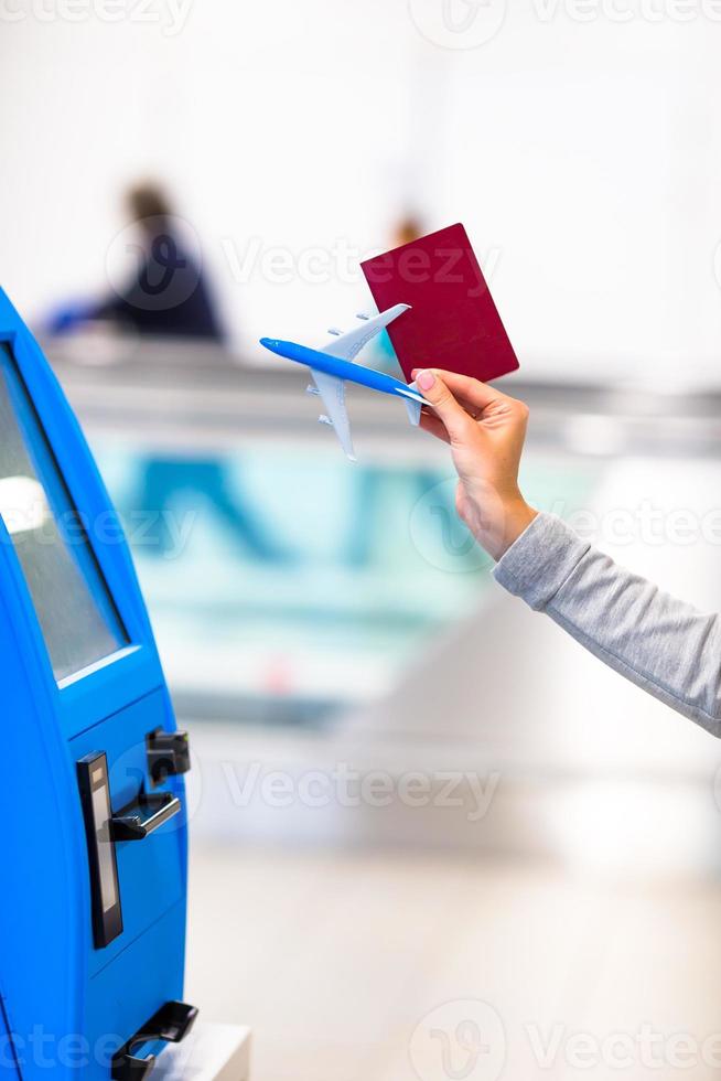 Terminal for self-check-in for flight or buying airplane tickets at airport photo