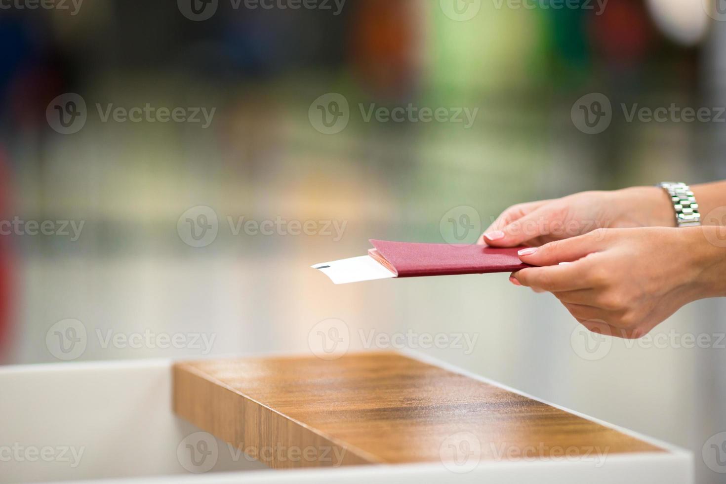 Closeup passports and boarding pass at airport indoor photo