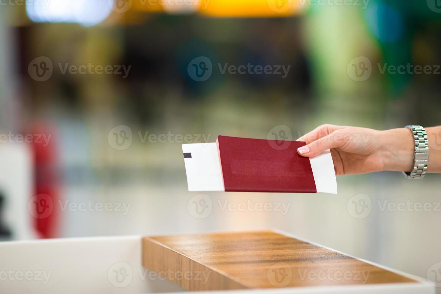 Closeup passports and boarding pass at airport indoor photo