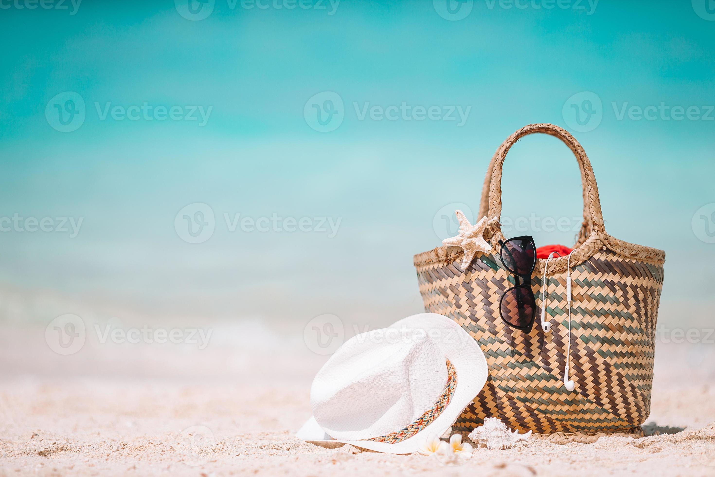 Beach accessories straw bag, hat and unglasses on the beach 17703647