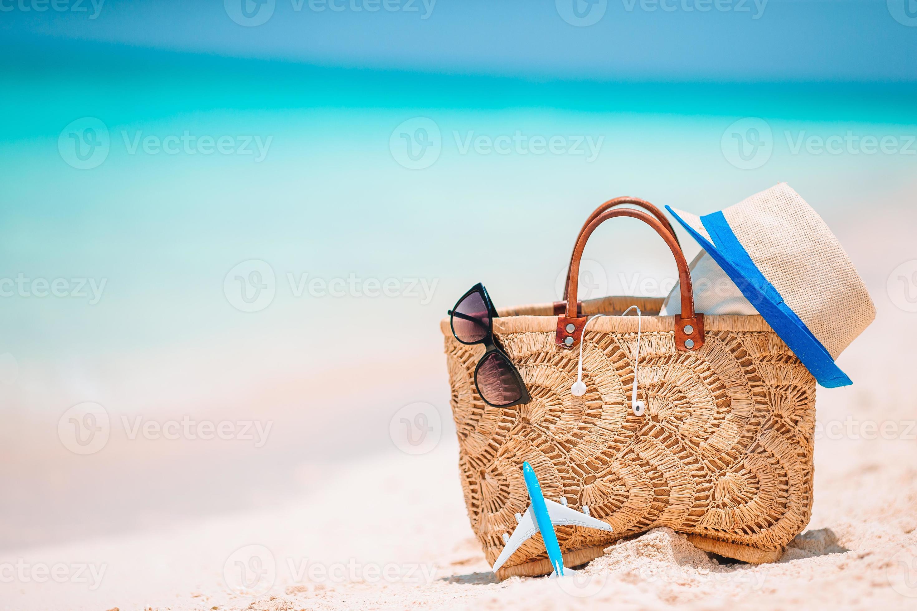 Beach accessories straw bag, hat and unglasses on the beach 17703677