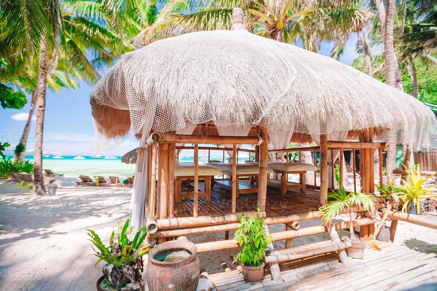 Massage exotic pavilion on the tropical beach photo