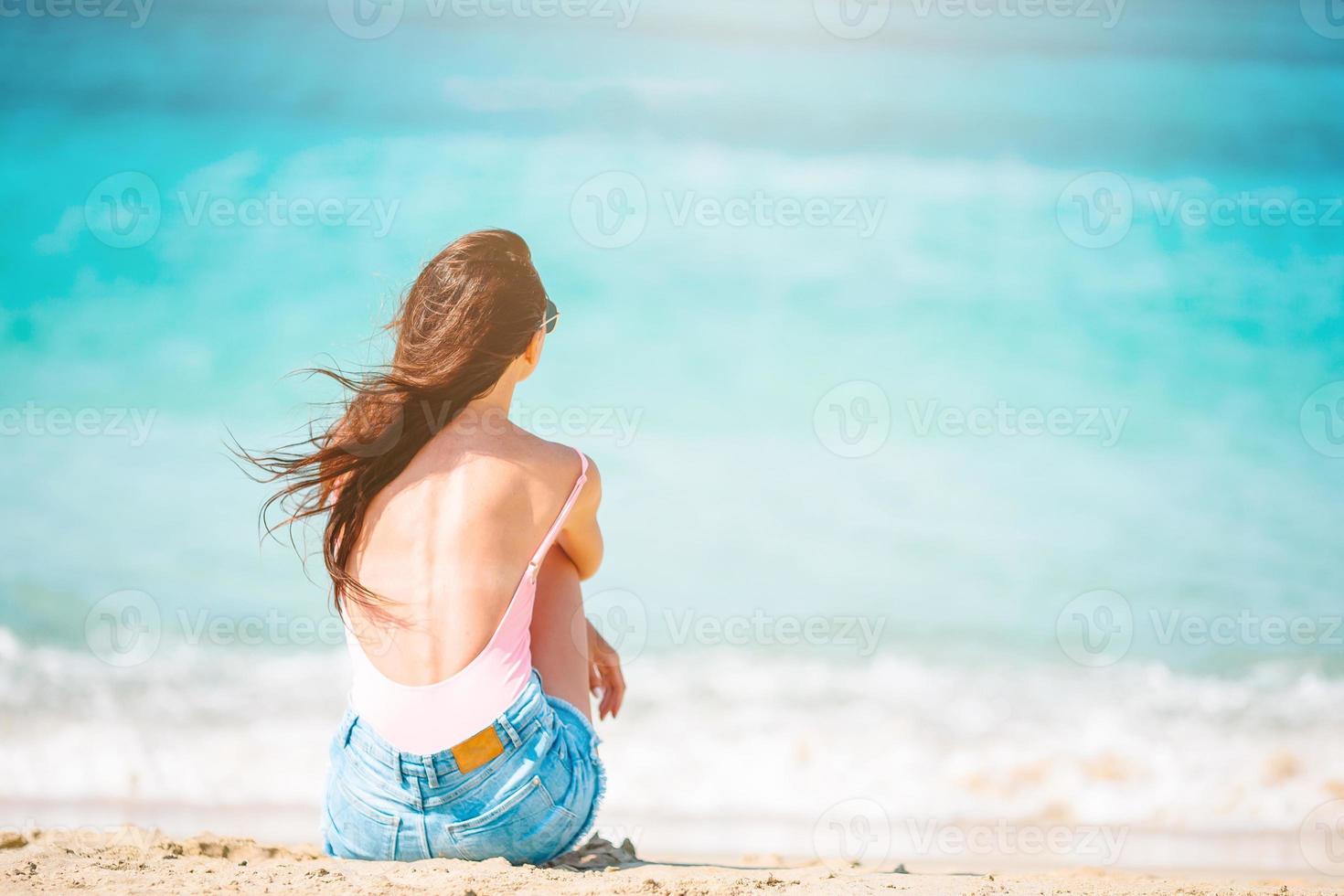 Young beautiful woman on the beach vacation photo