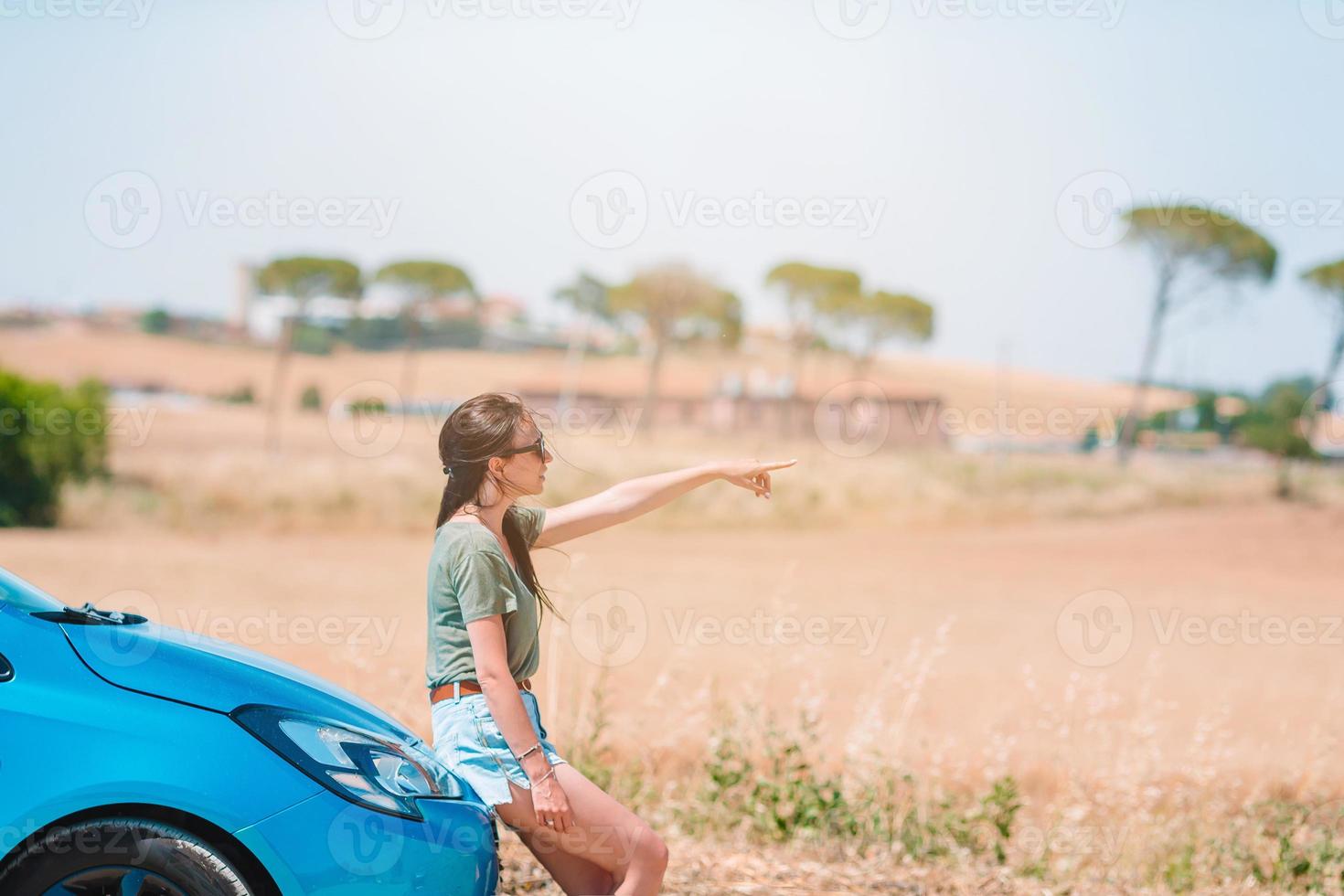 Woman for a new adventure looking for the right way on the map photo