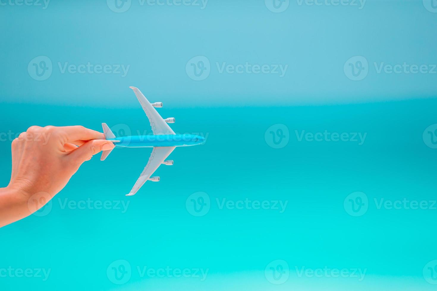 Closeup of map and model airplane background the sea photo