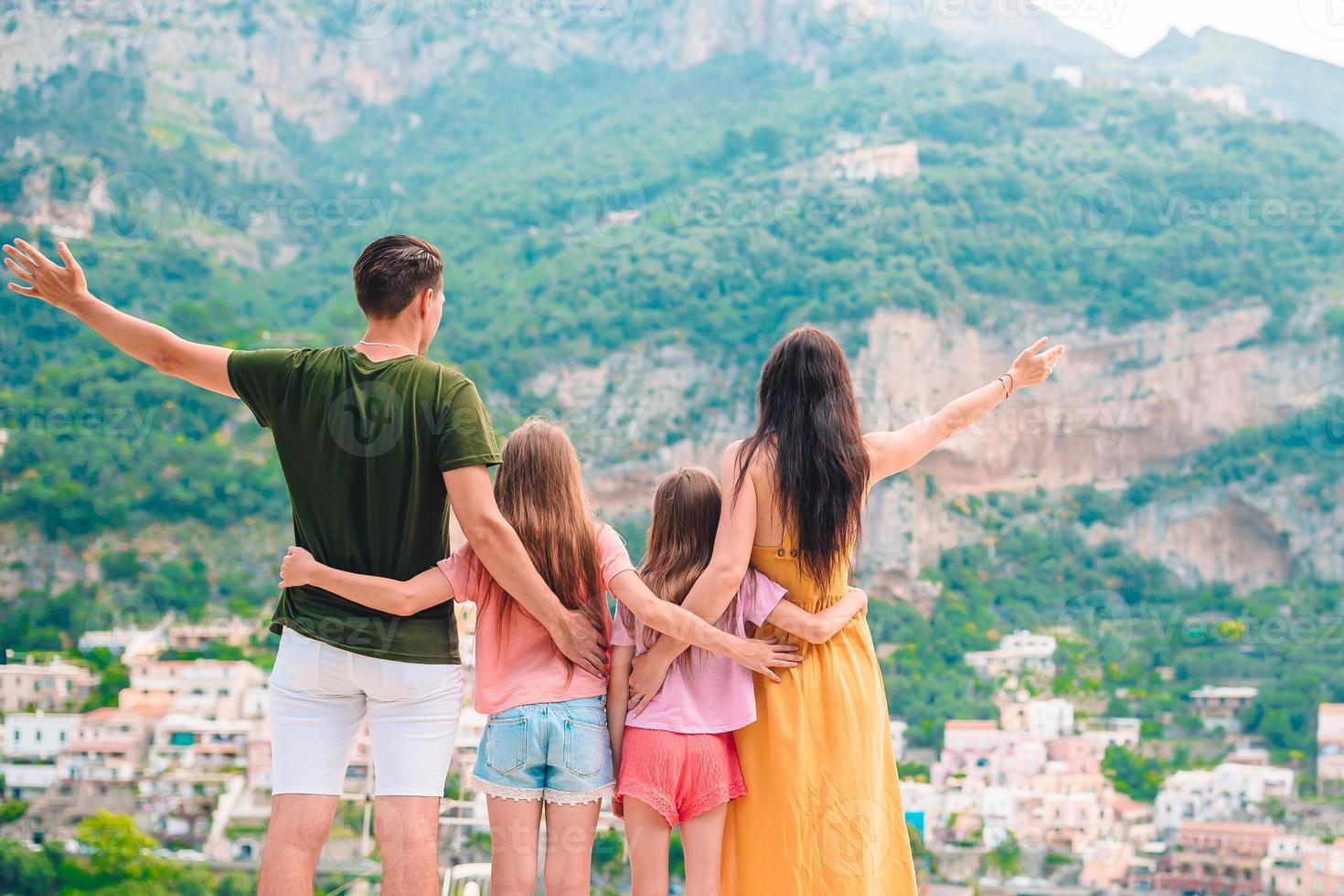 Summer holiday in Italy. Young woman in Positano village on the background, Amalfi Coast, Italy photo